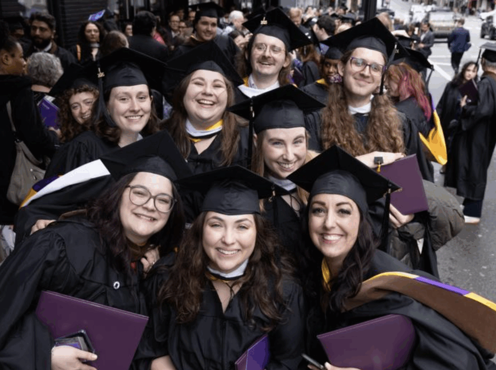 A group of graduates pose for a photo