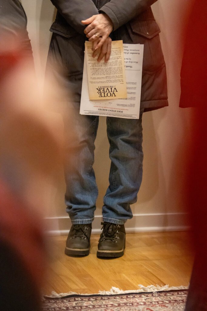 person holds a voting slip at the Iowa Caucus