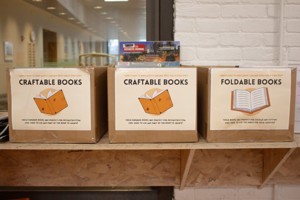 Three boxes of magazines and books that were available to use to make upcycled art