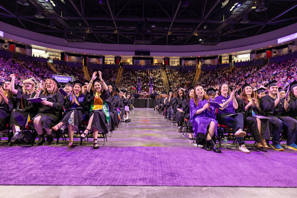 Students seated on the floor of the Agganis Arena