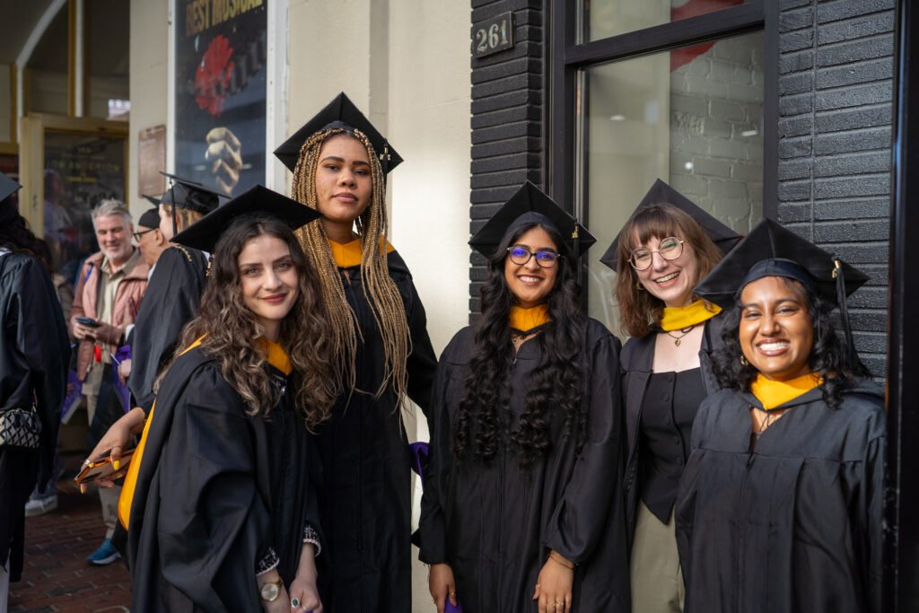 Group of grads pose for photo