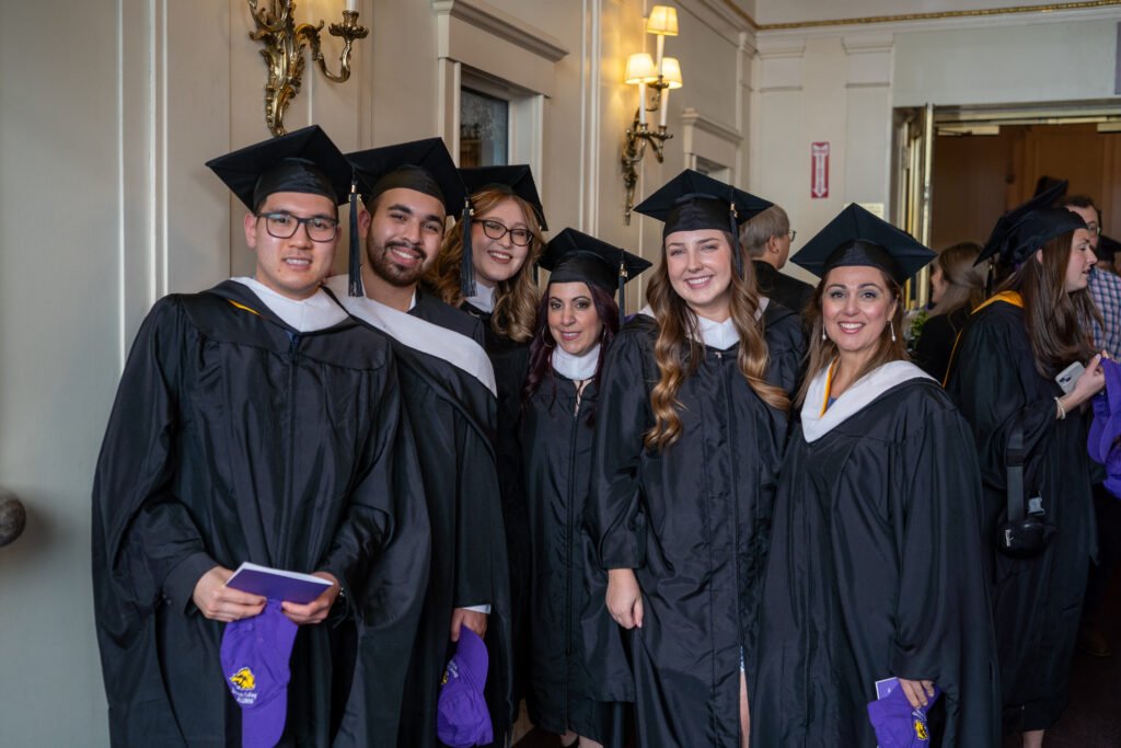 Group of grads pose for photo