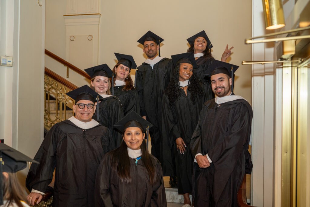 Group of grads pose for photo.