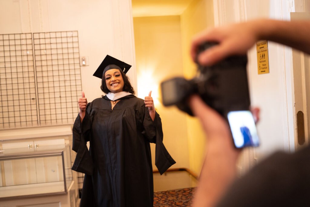 Grad poses with thumbs up