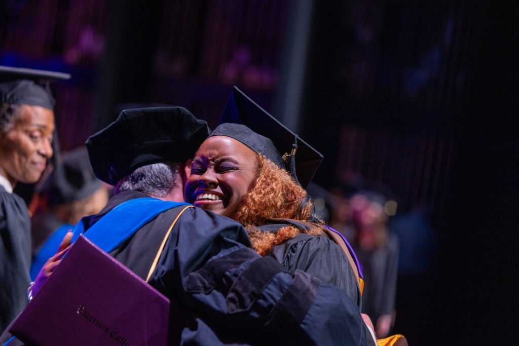 Grads smile and hug