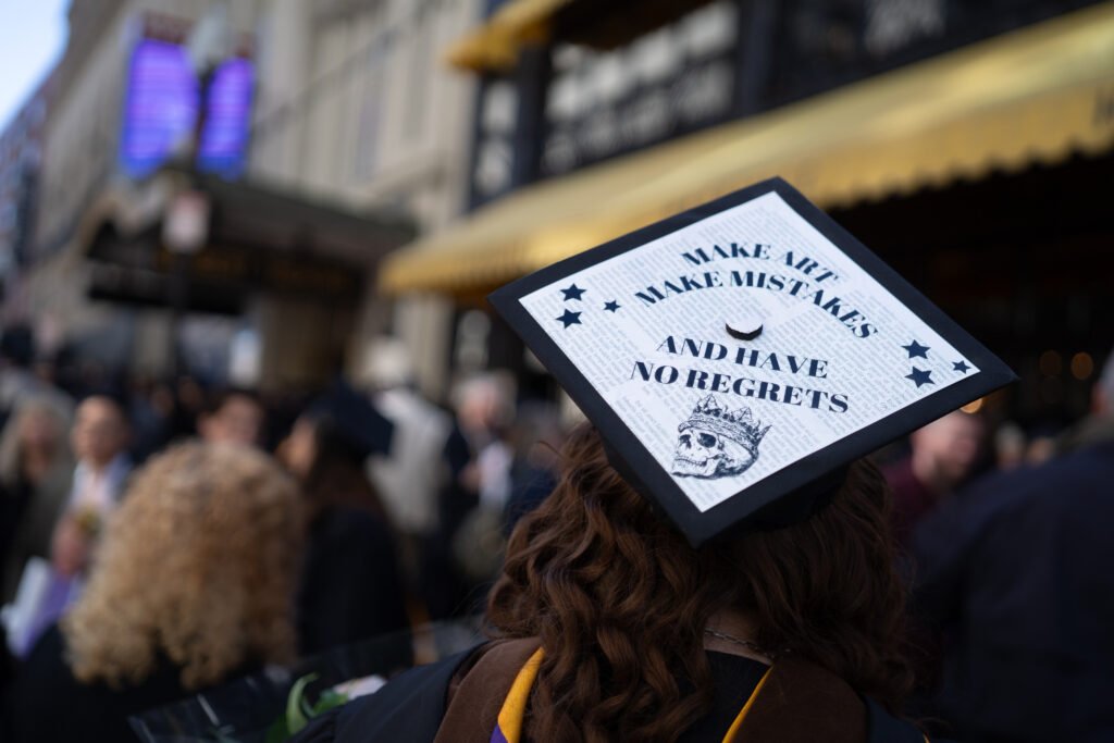 Grad's decorated cap.