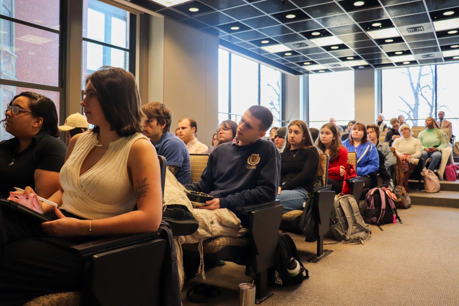 Students listening to the panel