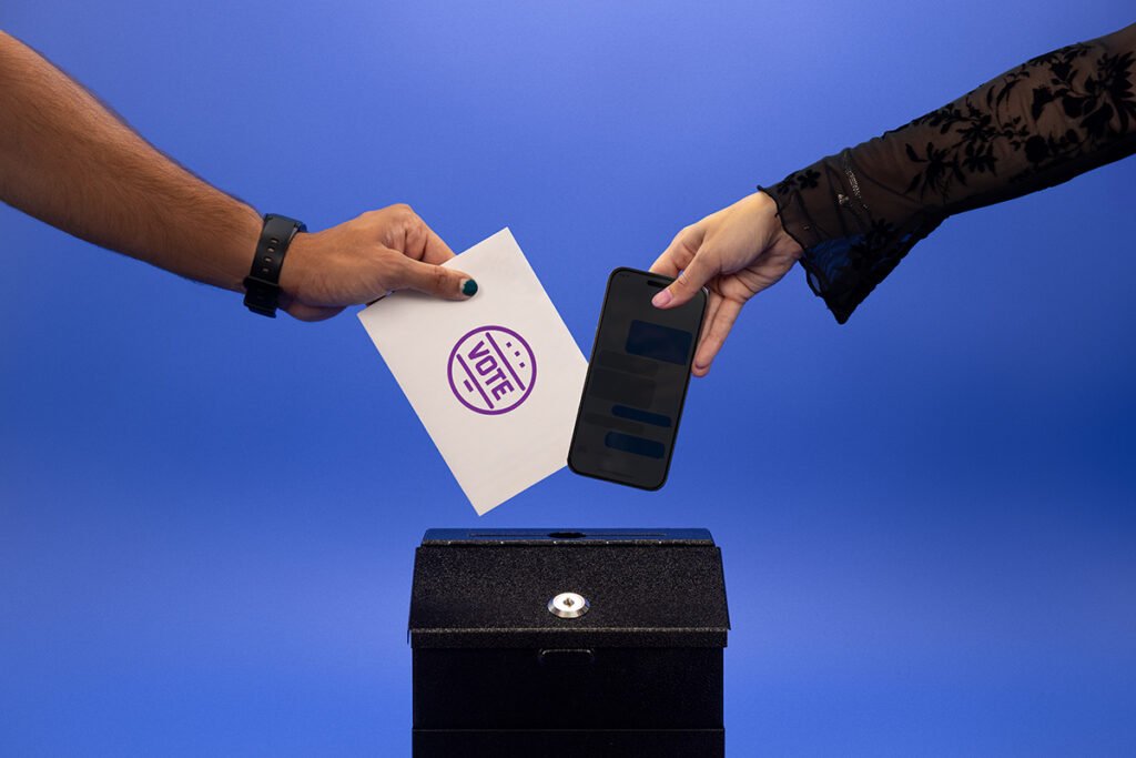 Hands placing polls into a box