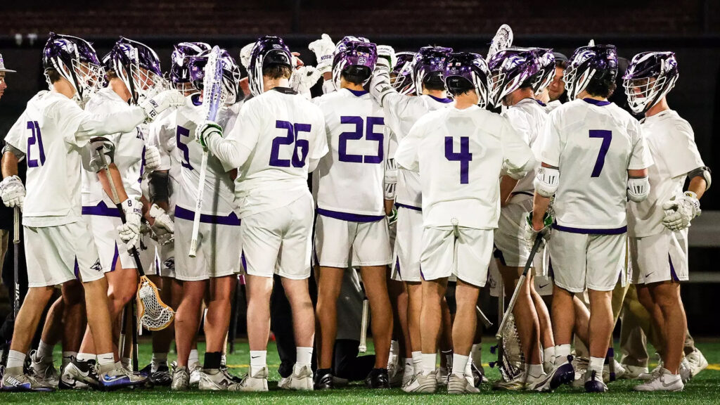 Men's lacrosse players huddle up