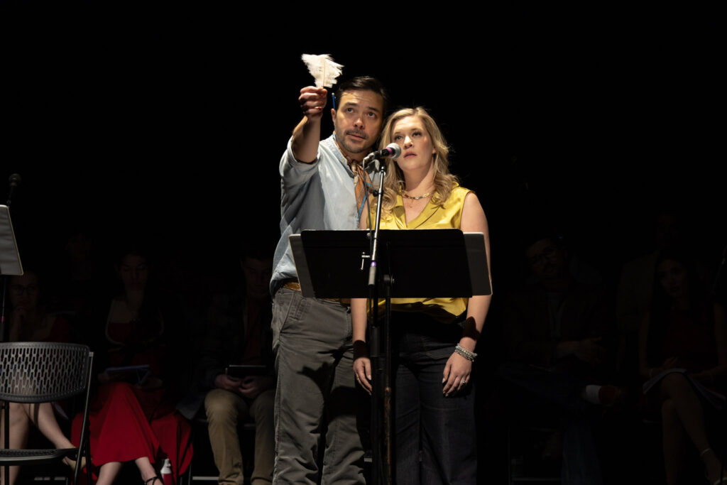 Sam Simakh points up while rehearsing a song with Lauren Chapman