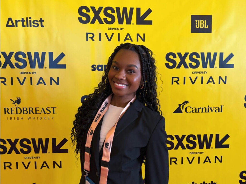 Nia Harmon in front of SXSW step and repeat