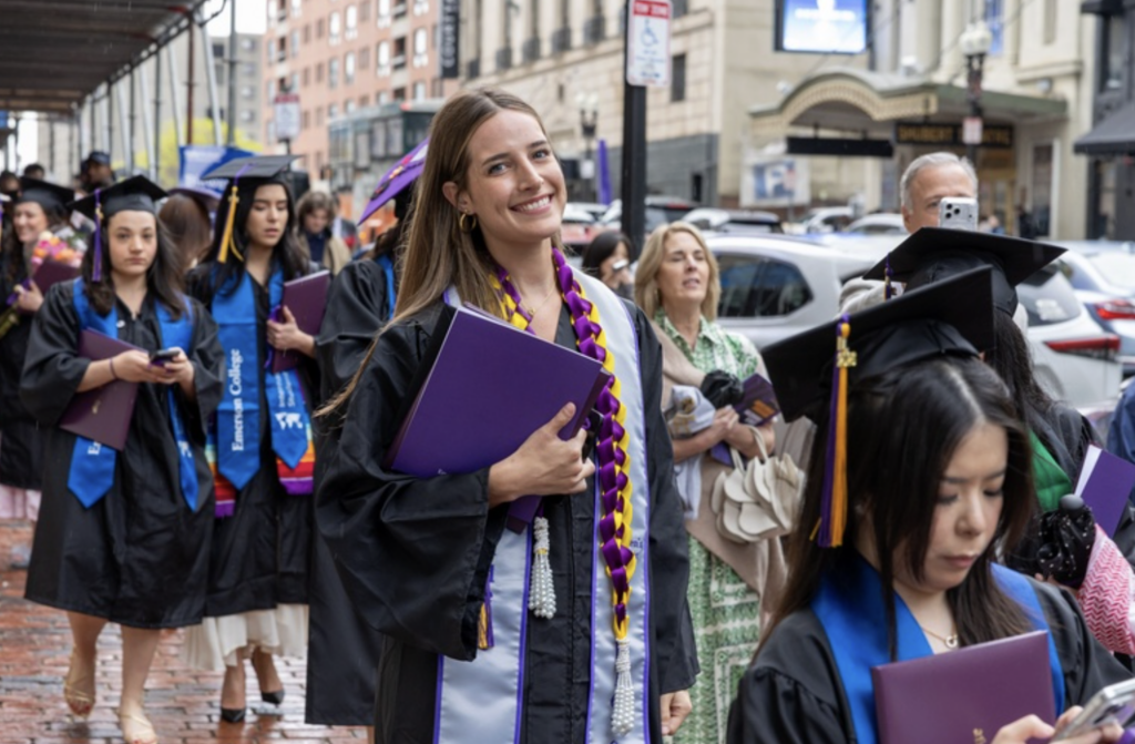 A person smiles as they walk
