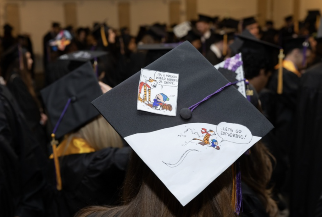 A Calvin and Hobbes comic on top of a mortar board