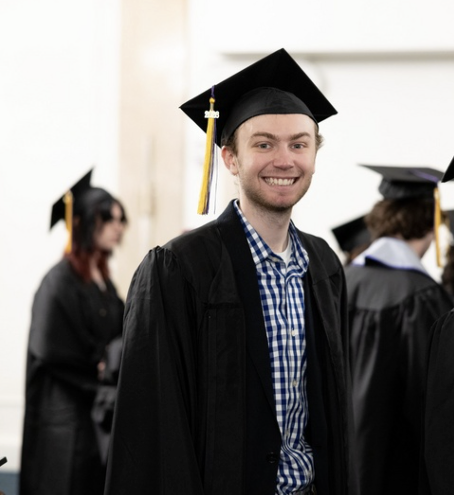 One person smiles for a photo