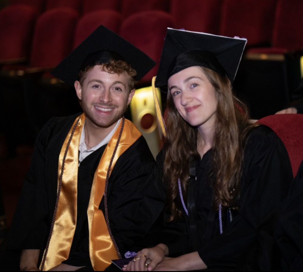 Two people pose for a photo
