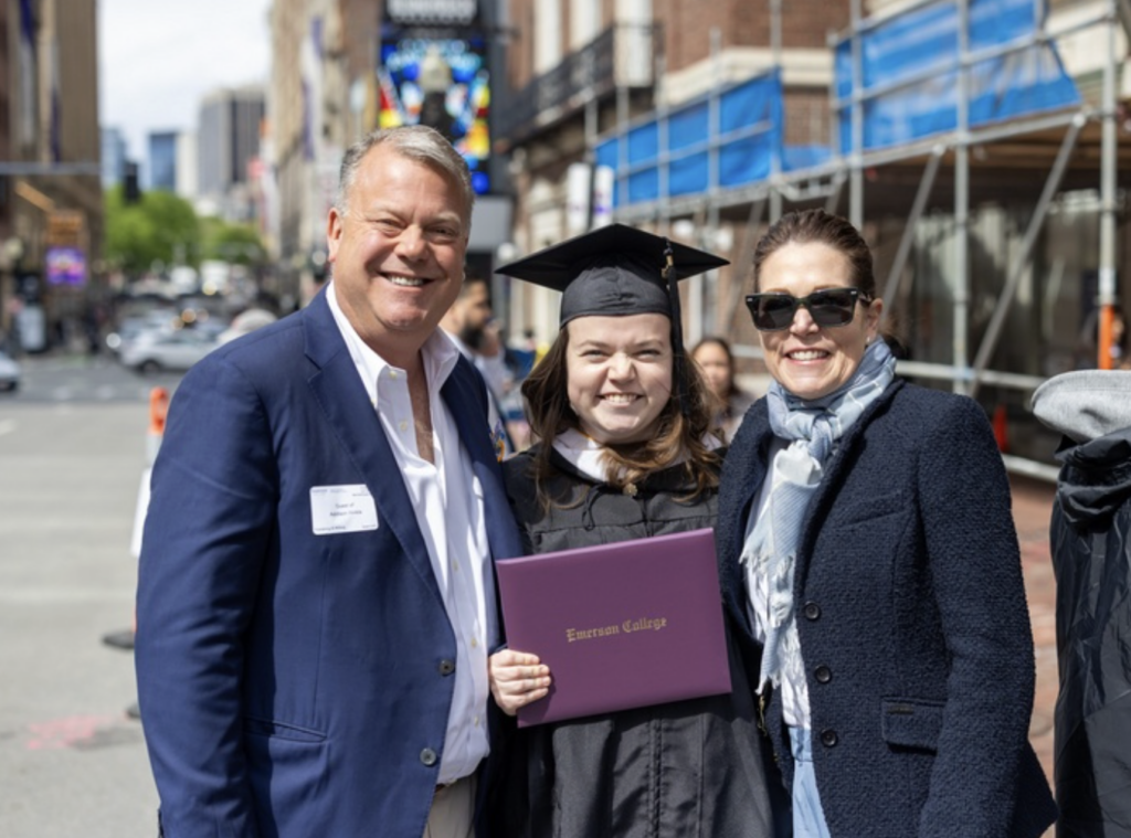 A graduate with their parents