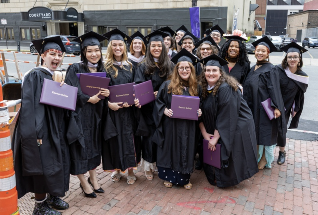 Graduates pose for a photo outside of the Wang Center