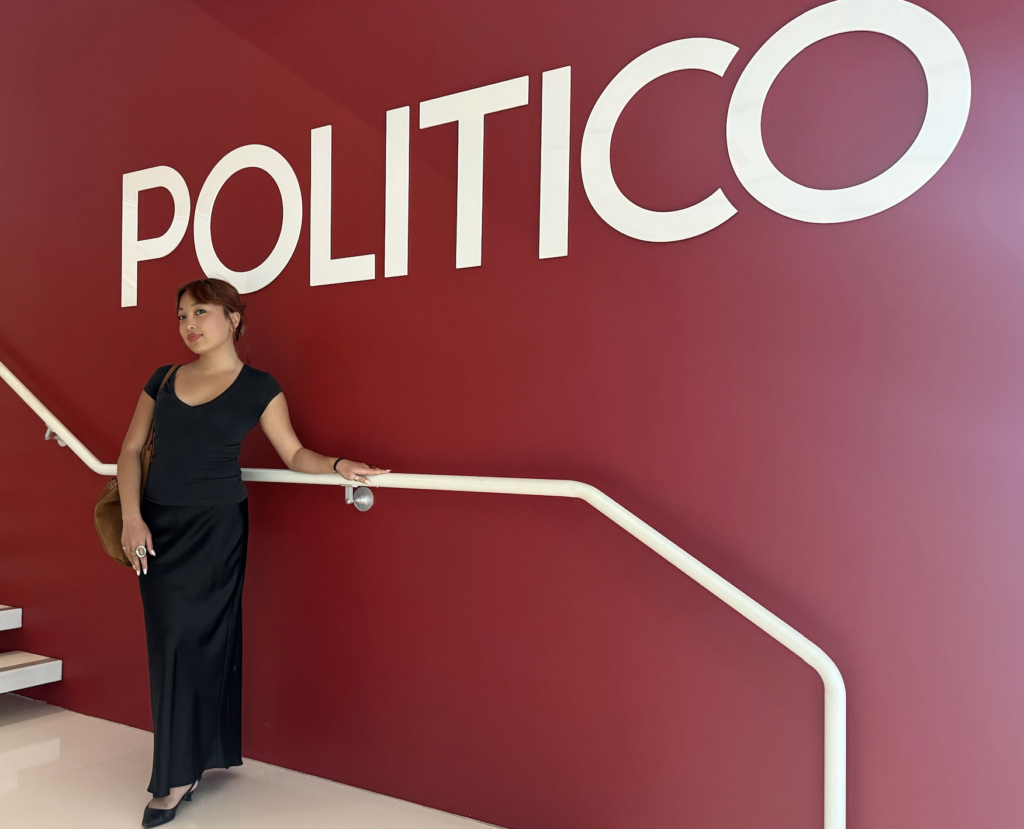 Sabrina Lam stands in front of a wall that says: Politico 